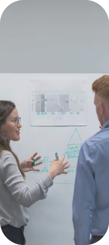 Corporate advisors planning on a whiteboard